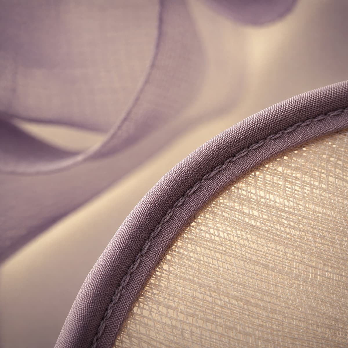 Close view of the wired and bound edge of a sinamay brim