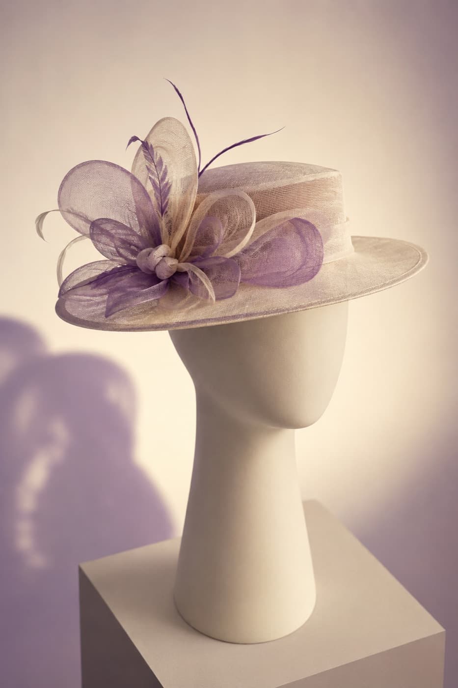 Satin-banded brim at a three-quarter angle on a featureless display block