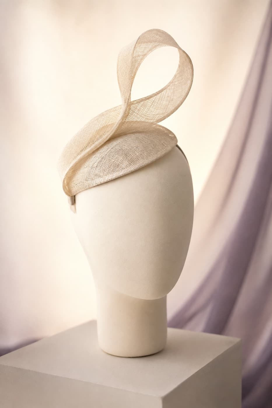 Fascinator Loop photographed whole against an ivory ground