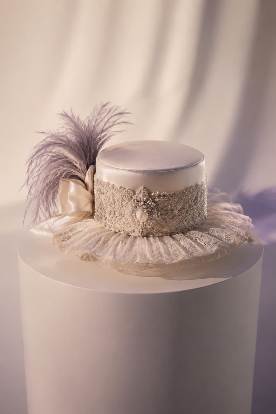 Pillbox Couture photographed whole against an ivory ground